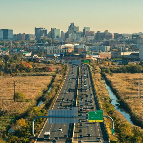 Skyline view of the city of Wilmington DE and i-95 highway showing Commuter Routes