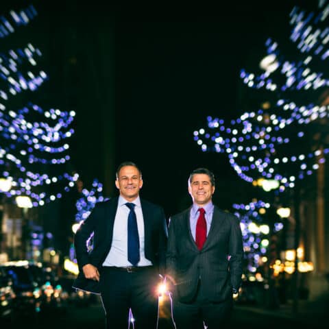 Buccini Brothers stand on Market Street between lighted trees